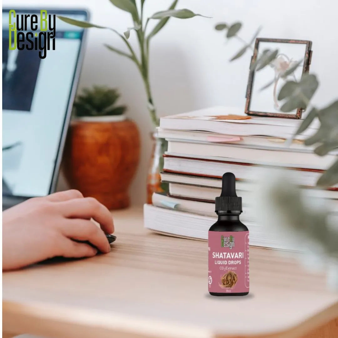 Bottle of Shatavari on a desk with a laptop and books in the background