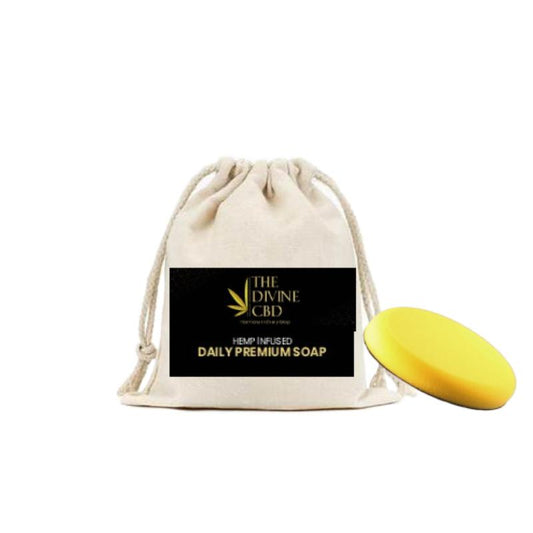 "Beige drawstring pouch with black label and a yellow oval soap bar."

