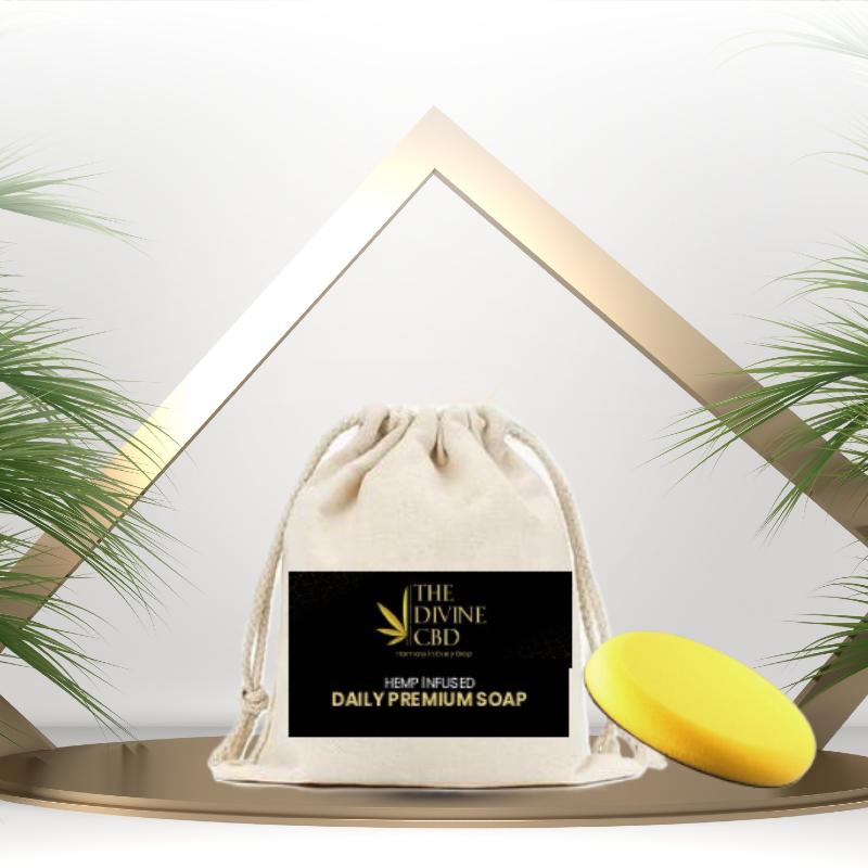 Beige drawstring bag with a label, and a yellow soap on a flat surface, flanked by green plants.

