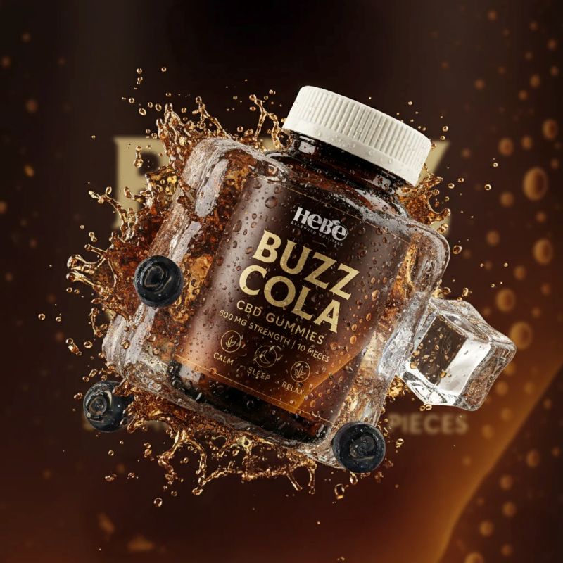 Jar of 'Buzz Cola' gummies with ice cubes and splashes on a dark background
