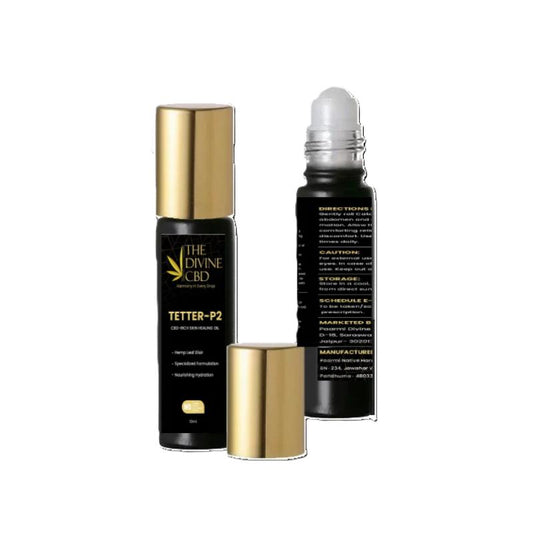 Black bottles with golden caps, one with a removed cap revealing a roll-on applicator, labeled "THE DIVINE CBD" and product details.