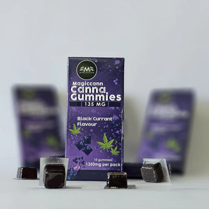 A purple package of Magiccann Cannabis Gummies with black currant flavor and cannabis leaf design.