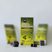 Load image into Gallery viewer, Box of Magiccann Cannabis Gummies with dark gummies in blister packs.
