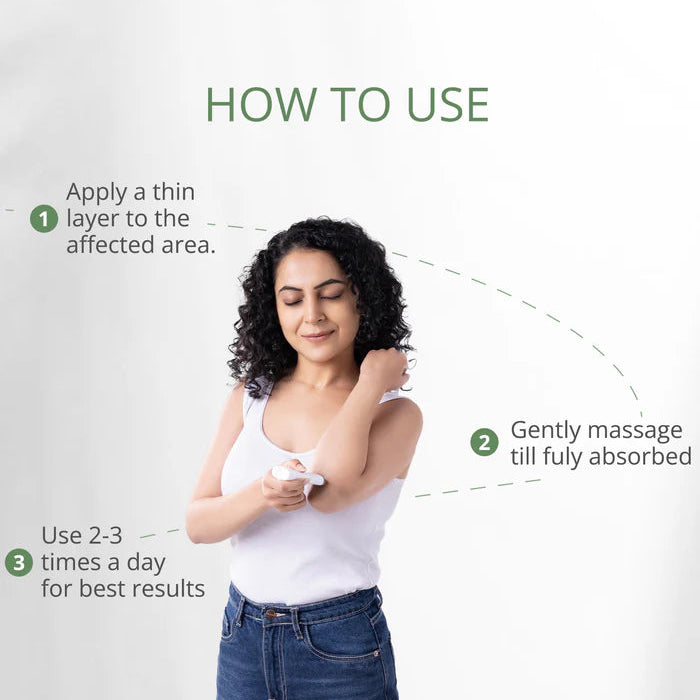Woman applying CBD cream to her arm with instructions on how to use it.