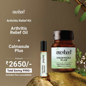 a bottle of cannabis oil and capsules next to a rock