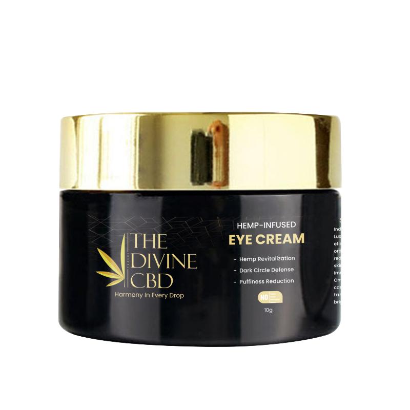 Black jar with gold lid labeled "The Divine CBD Hemp-Infused Eye Cream."

