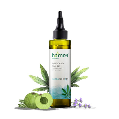 Hemp Amla hair oil bottle with leaves and fruits on a white background