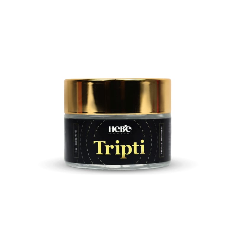A jar of Hebe Wellness Tripti THC Oil with a black label and gold lid.

