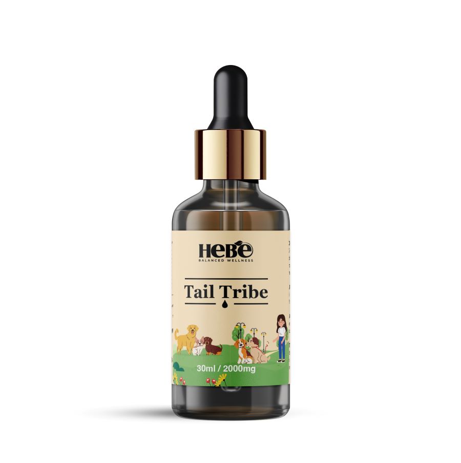 Brown glass dropper bottle of Hebe Wellness Pet CBD oil labeled "Tail Tribe" with dog illustrations.

