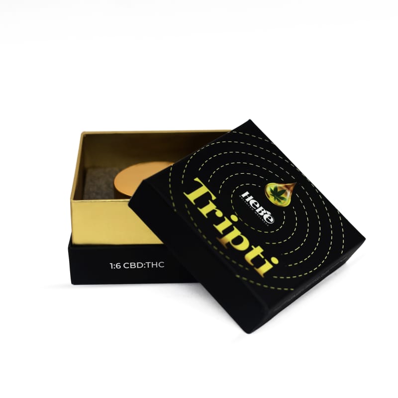 Black and gold hebe wellness THC Oil packaging with "Tripti" label.

