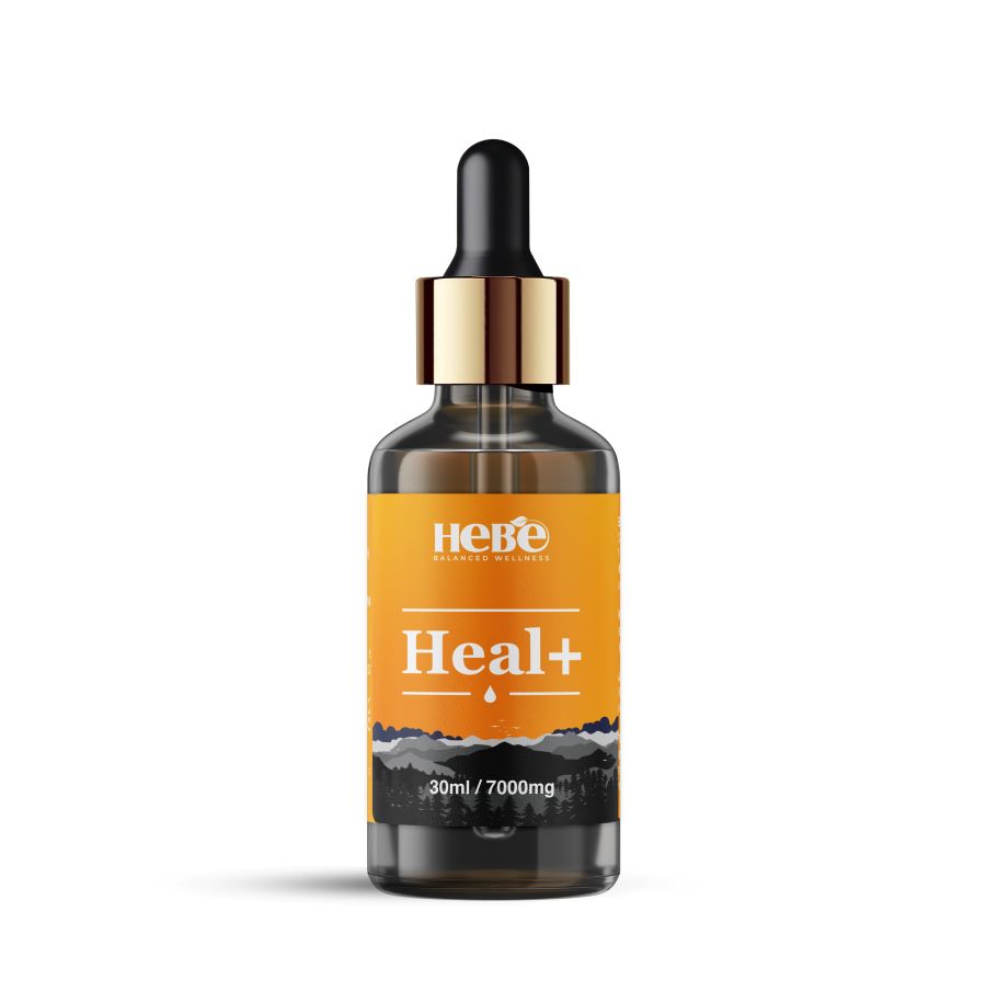 A bottle of Hebe Wellness Heal+ CBD oil with an orange label.