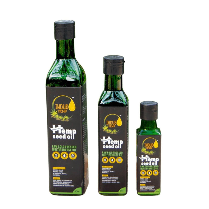 Three bottles of Indus Hemp Seed Oil on a white background