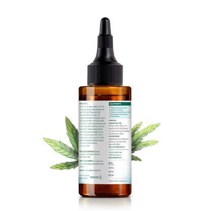 CBD oil bottle with cannabis leaves on a white background